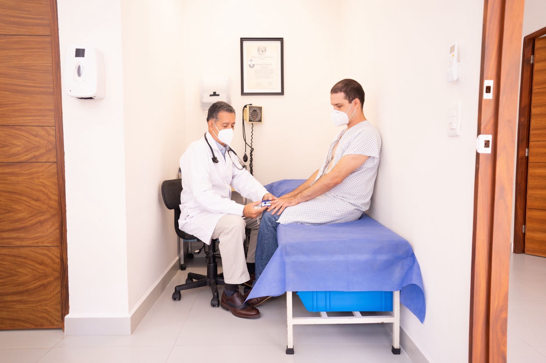 Doctor consulting with a patient in a clinic room