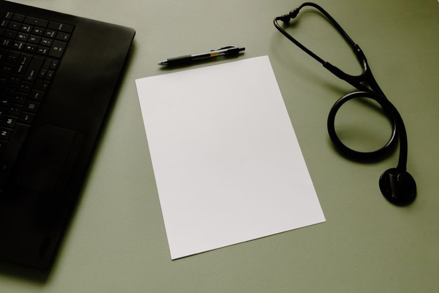 Stethoscope and notes on a consulting desk